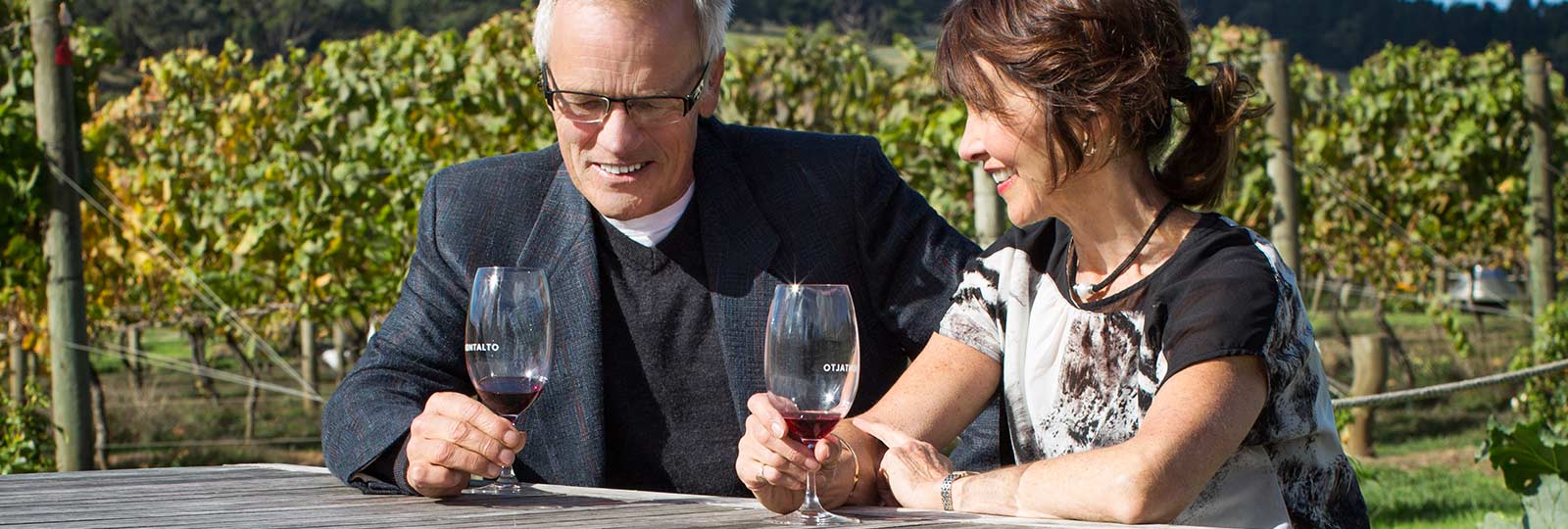 Hearing loss couple with hearing aids at winery