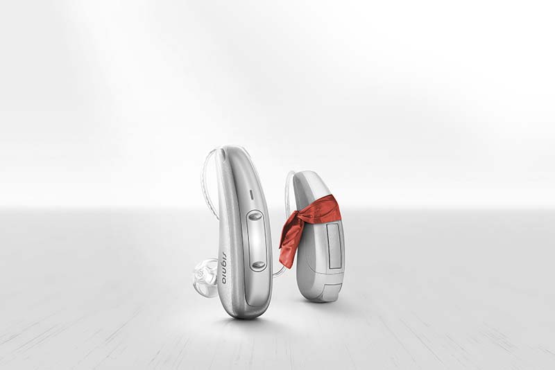 Blind folded Signia Xperience Pure Charge&Go X hearing aids